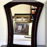 DM06. Black framed keystone-shaped mirror. 36”h x 26”w 